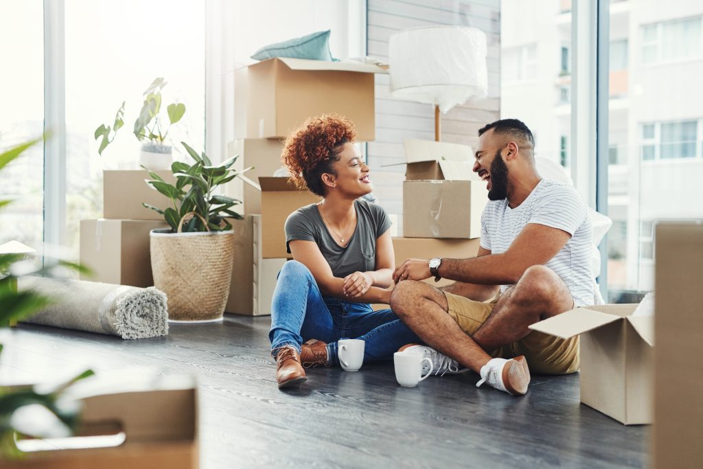 Sempris Shot of a young couple taking a break while moving house