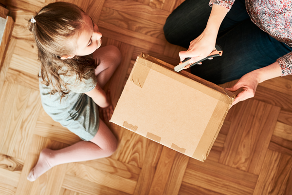 Woman and child opening a box