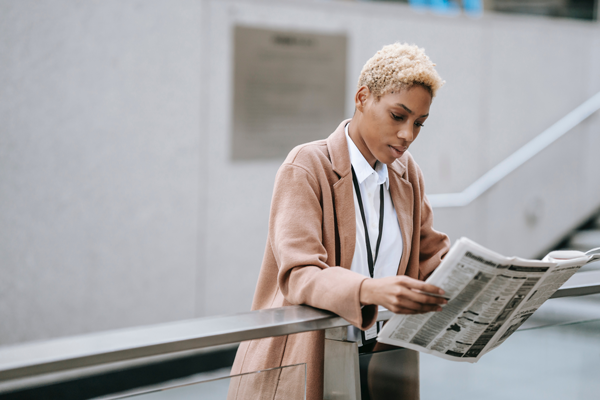 Woman reading newspaper