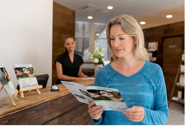 Woman reading pamphlet