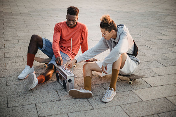 Couple sitting by boombox