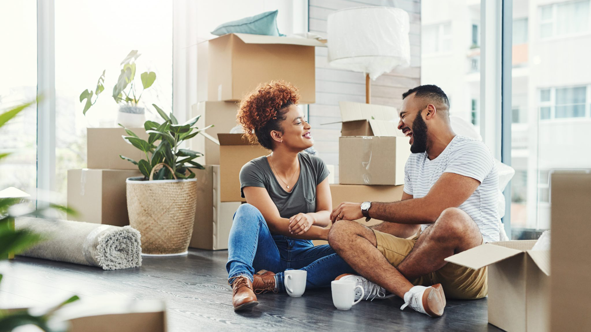 Sempris Shot of a young couple taking a break while moving house