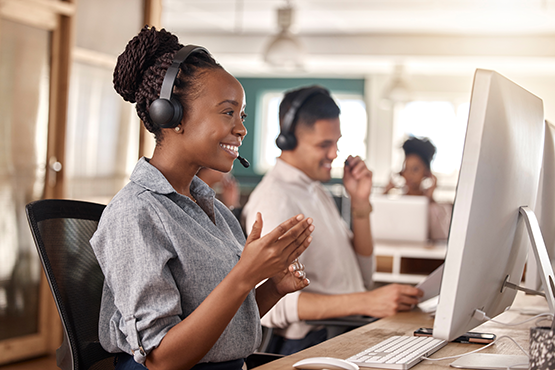 Call center workers talking on the phone